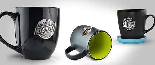 Set of matching glassware (e.g., whiskey glasses) each adorned with a uniform pewter badge.